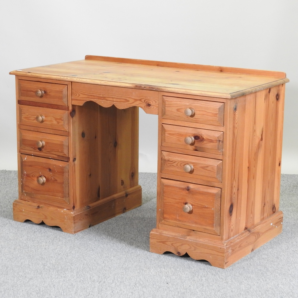 A pine pedestal desk,