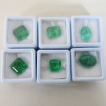 A collection of six unmounted natural emerald gemstones,