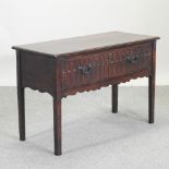 A 19th century oak side table, with a single drawer, and thumbnail decoration,