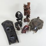 A collection of ethnic carvings and tribal masks