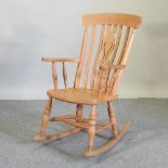 A beech splat back rocking chair