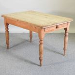 An early 20th century pine dining table,