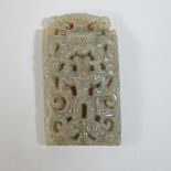 A modern carved jade coloured hardstone pendant,