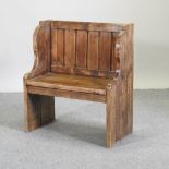 A small hand-made pine settle,
