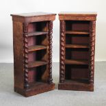 A pair of Victorian walnut book cases, with barley twist supports,