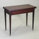 A George III mahogany tea table, on leather castors,