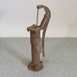 A large cast iron garden water pump,