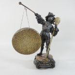 A 19th century continental spelter dinner gong, in the form of a Cavalier, on a marble base,