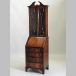 A reproduction mahogany bureau bookcase,