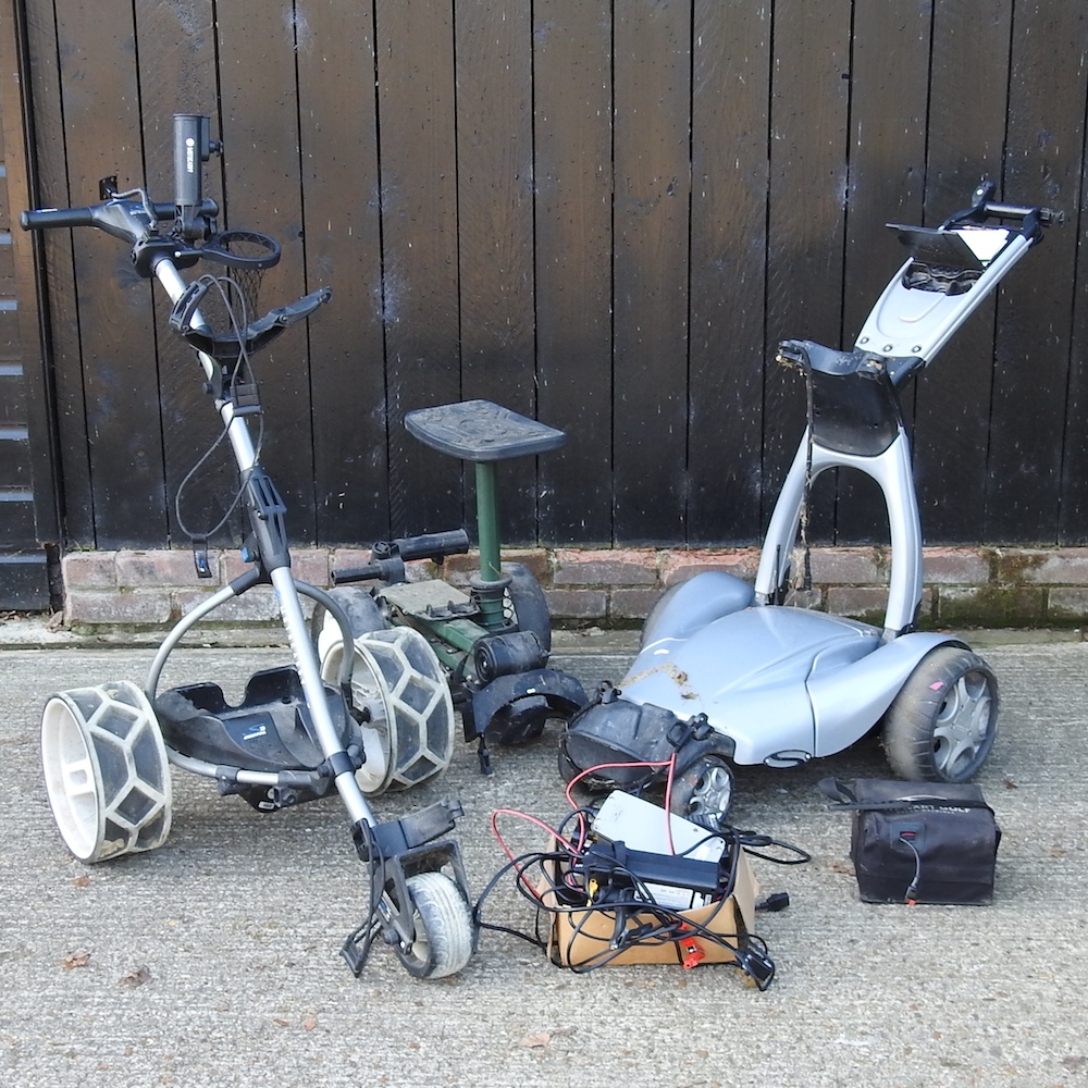 A collection of golf caddies and carts