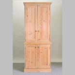 A pine hall cupboard, with a dentil moulded cornice,