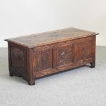 An 18th century carved oak coffer,