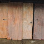 A collection of four various wooden doors,