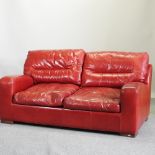 A modern red upholstered sofa,