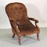 A Victorian mahogany brown upholstered button back armchair