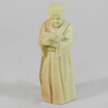 A Royal Worcester candle snuffer, in the form of a monk, circa 1900,