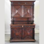 A 19th century continental oak side cabinet, enclosed by panelled doors,