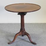 A 19th century mahogany occasional table, on a tripod base,