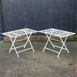 A pair of cream painted metal folding garden tables,