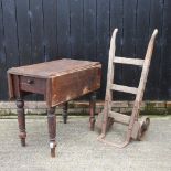 An antique wooden sack barrow, together with a 19th century pembroke table,