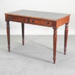 A Victorian mahogany writing table, with an inset writing surface,