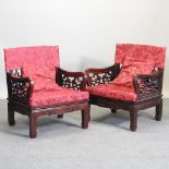 A pair of Chinese carved hardwood arm chairs