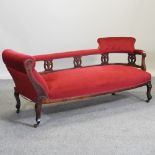 A Victorian mahogany and red upholstered chaise longue,