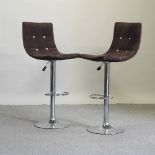 A pair of 1970's brown upholstered bar stools
