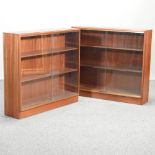 A pair of mid 20th century Gordon Russell teak bookcases, each with glazed fronts,