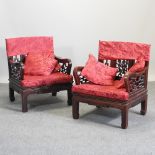 A pair of Chinese hardwood arm chairs