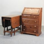 A pine bureau, together with a 1920's gateleg table,