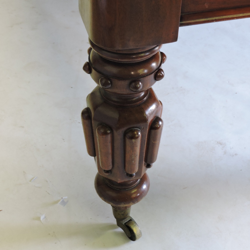 A large 19th century mahogany pull out extending dining table, with two additional leaves, - Image 8 of 9