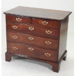 A George III mahogany chest, containing two short, over three long drawers, on bracket feet,