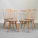 A set of four Ercol light elm dining chairs