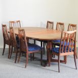 A 1970's teak extending dining table, with two additional leaves, 233 x 134cm overall,