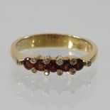 An 18 carat gold ruby and diamond half hoop eternity ring,