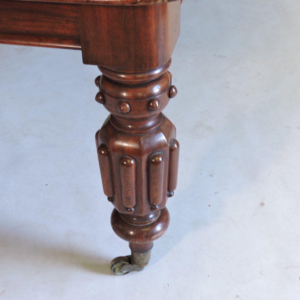 A large 19th century mahogany pull out extending dining table, with two additional leaves, - Image 4 of 9