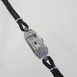 A platinum and diamond cased ladies cocktail watch,