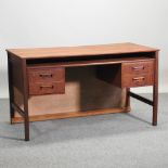 A 1970's teak desk,