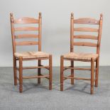 A set of four rush seated dining chairs