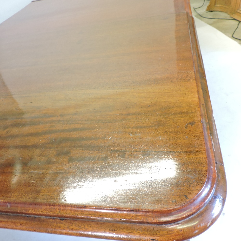 A large 19th century mahogany pull out extending dining table, with two additional leaves, - Image 6 of 9