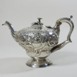 A George III silver bachelor's teapot, of circular pedestal shape,