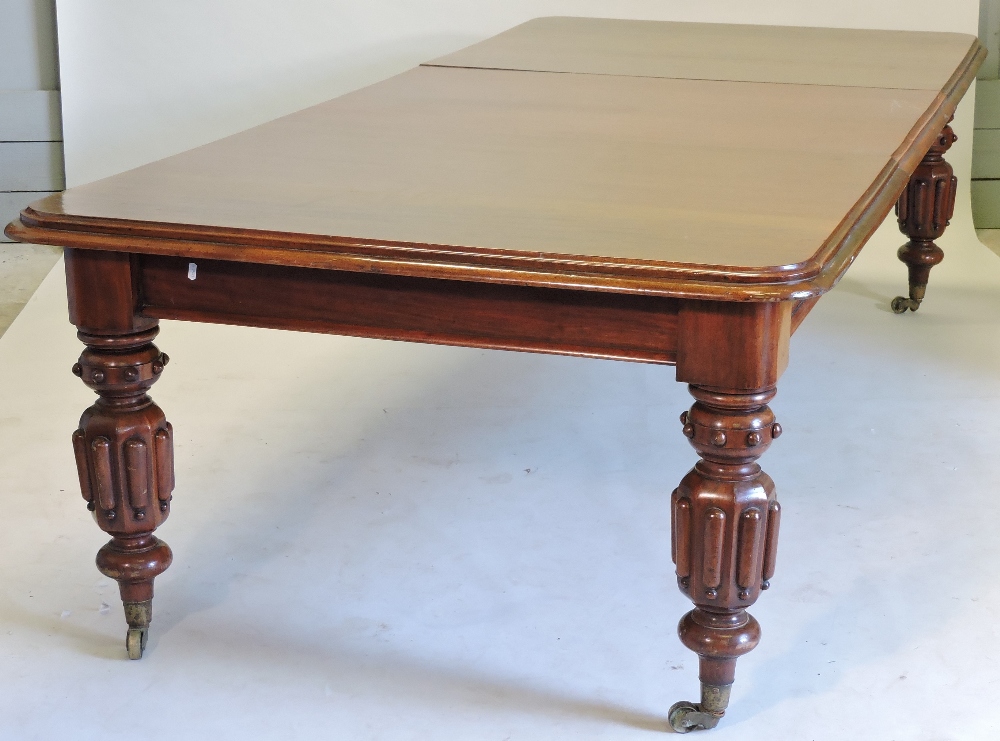 A large 19th century mahogany pull out extending dining table, with two additional leaves, - Image 5 of 9