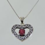 A 9 carat gold and ruby heart shaped pendant,