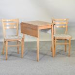 A vintage melamine drop leaf kitchen table, 92 x 60cm overall,