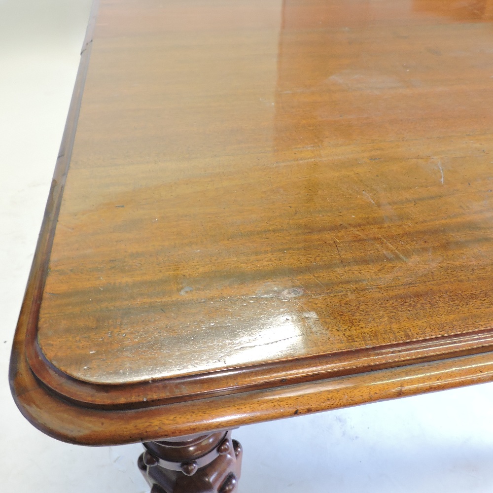 A large 19th century mahogany pull out extending dining table, with two additional leaves, - Image 2 of 9