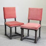 A set of six red upholstered dining chairs on bobbin turned legs