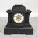 A Victorian black slate mantel clock,