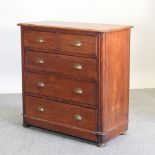 A Victorian teak chest, on a plinth base,