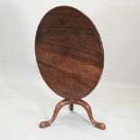 A 19th century mahogany tilt top table, with a bird cage action, on a tripod base,